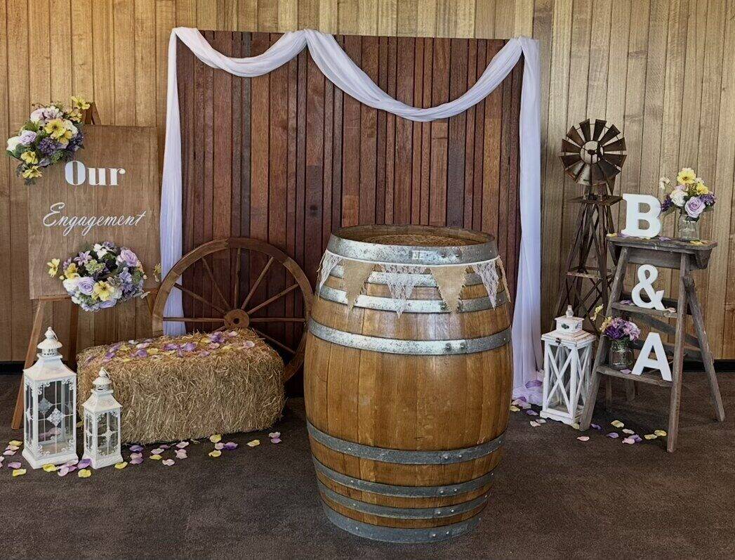 Authentic oak wine barrel styled as an engagement display with floral and timber accents